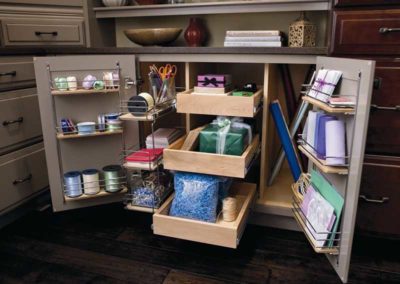Kitchen cabinet drawers with custom storage compartments.
