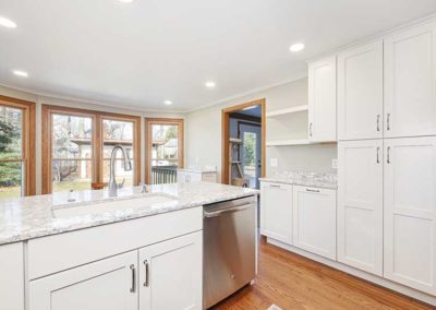 Kitchen with white cabinets.