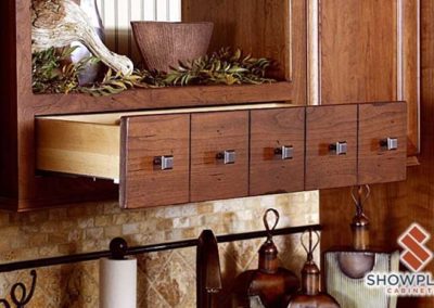 Dark wood kitchen cabinets with extra drawer space.