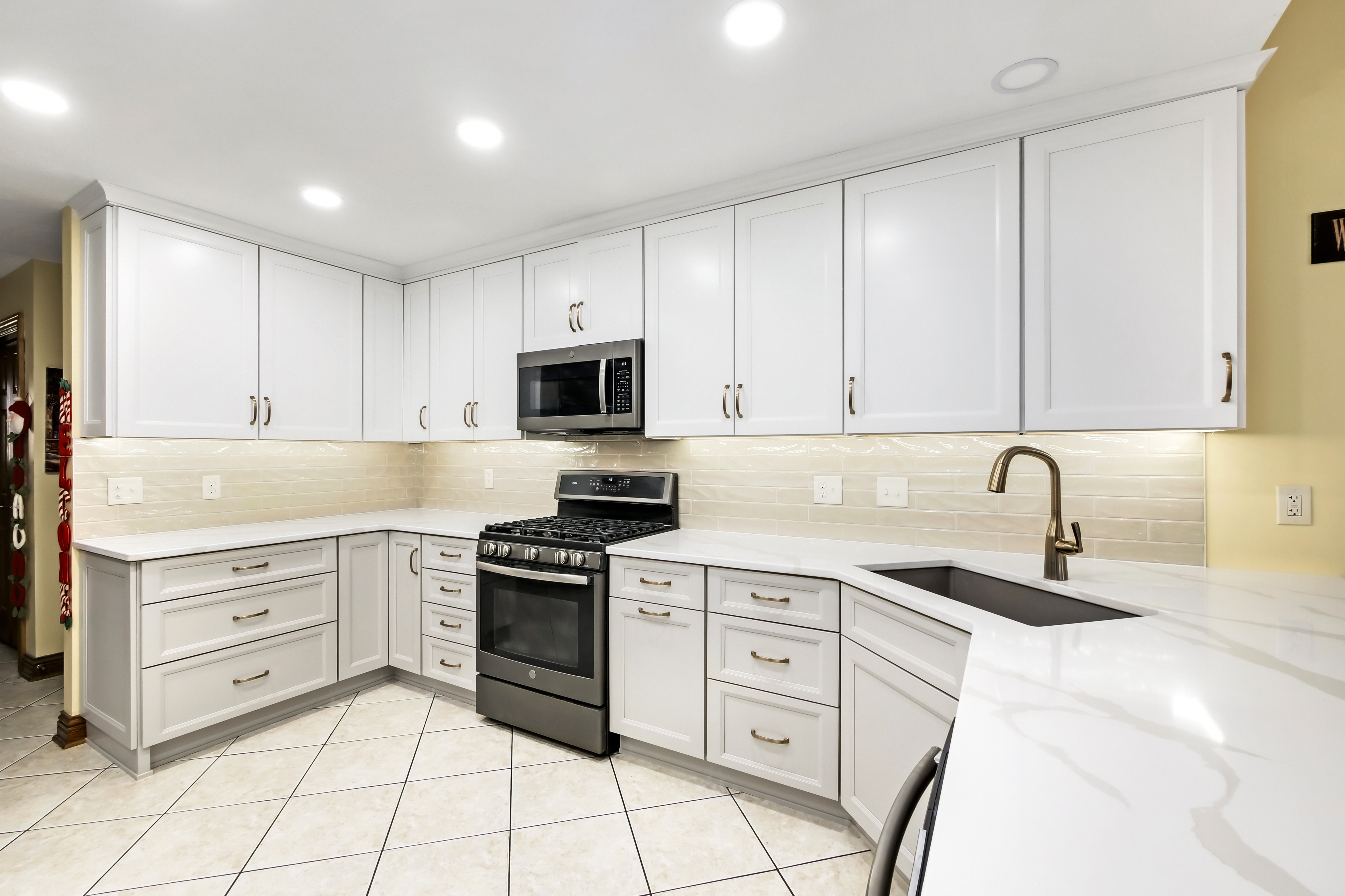 Hughes crew finishing an interior kitchen installation